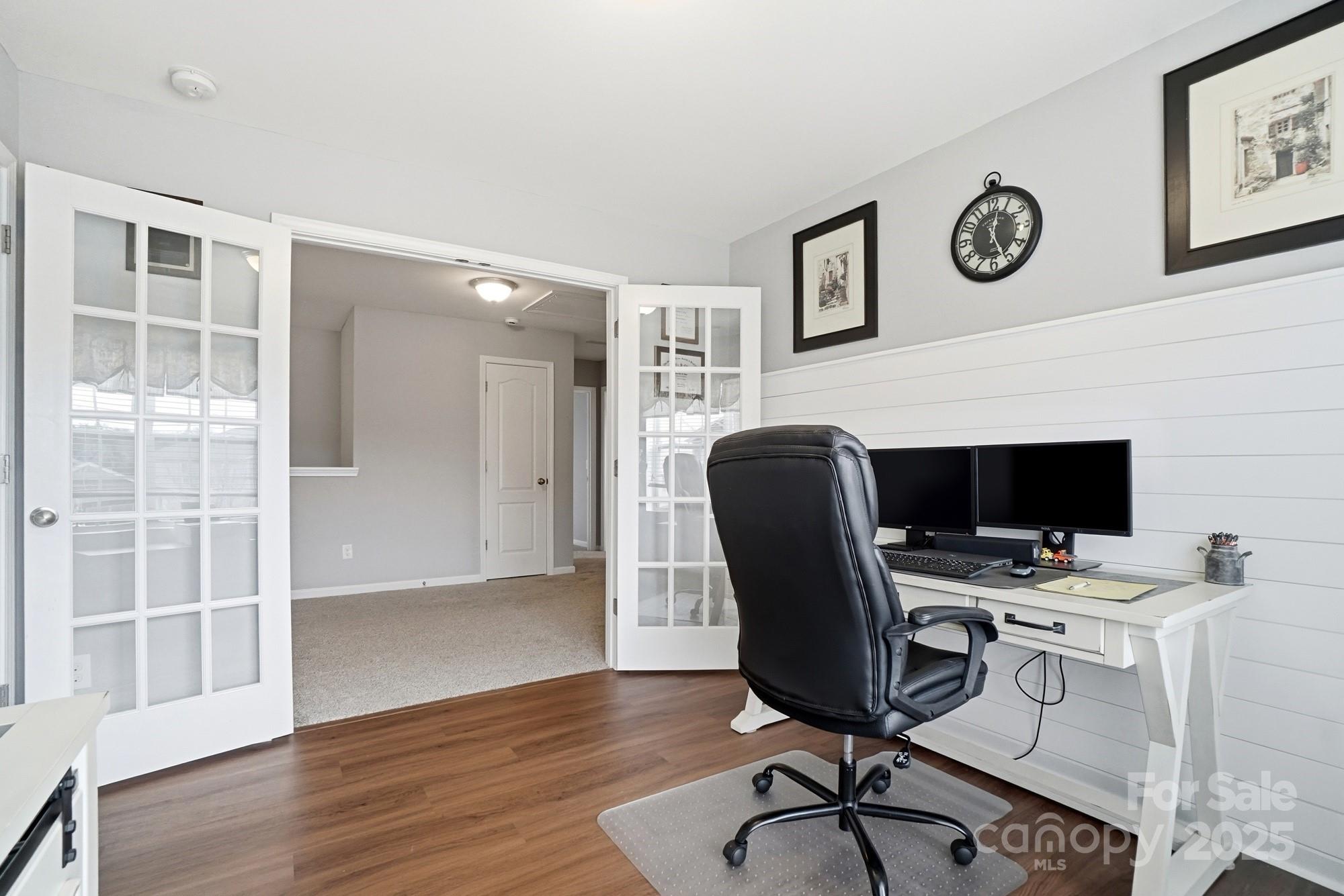 5033 Haven Lodge Road Matthews, NC 28104 - Photo 27 of 37 a view of a workspace with furniture and wooden floor