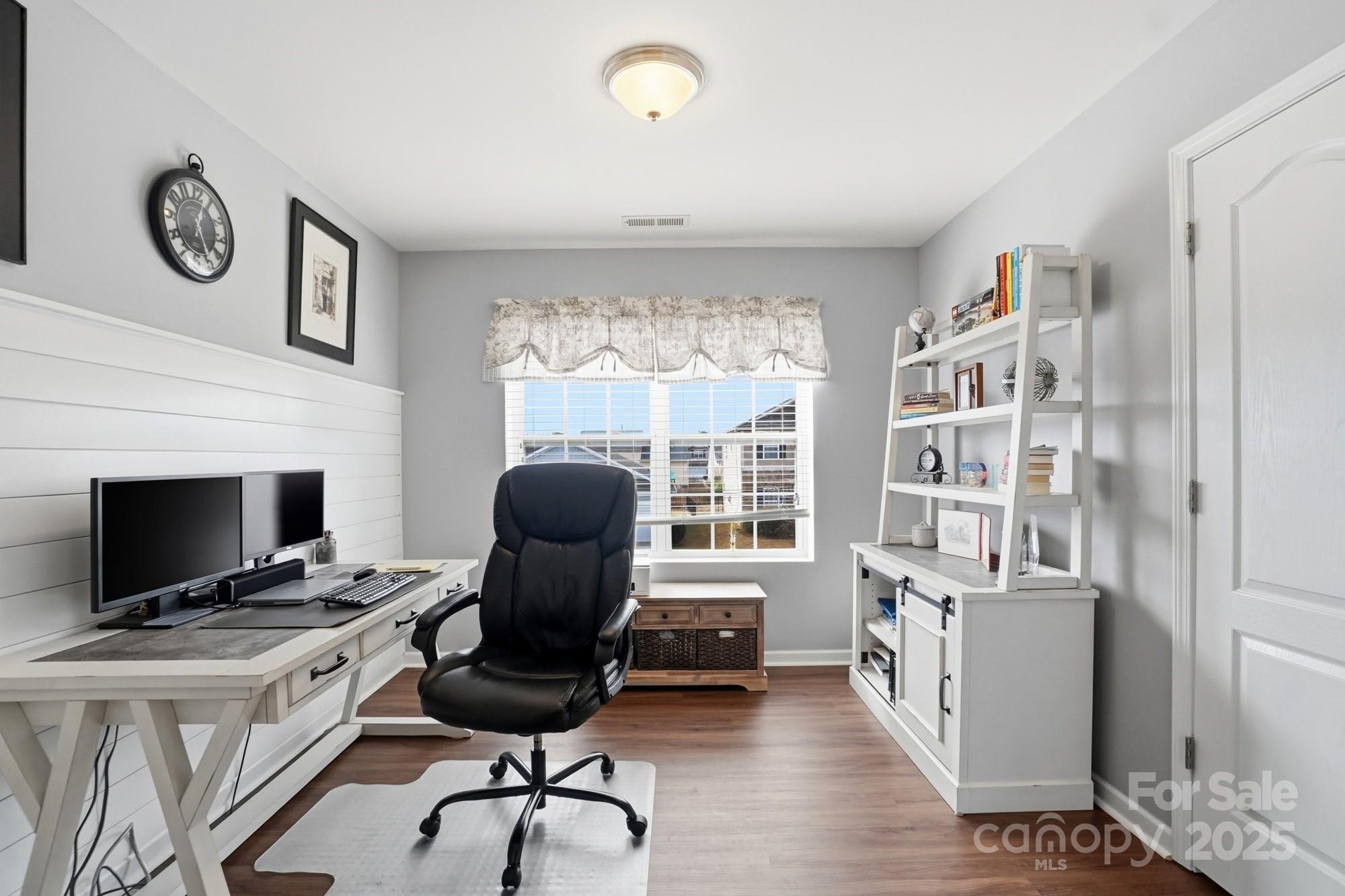 5033 Haven Lodge Road Matthews, NC 28104 - Photo 28 of 37 a view of a workspace with furniture and a fireplace