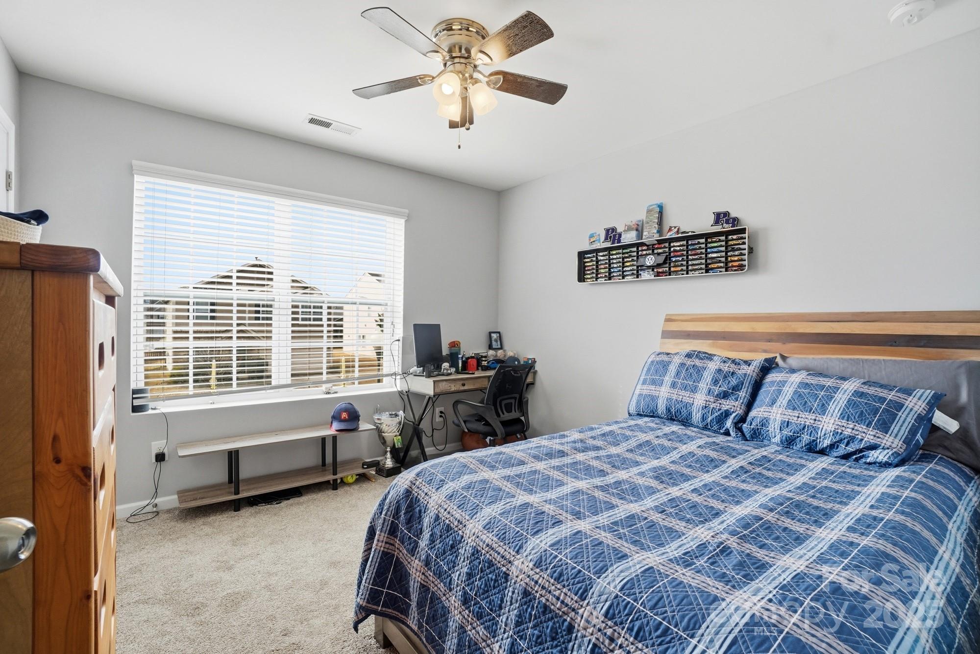5033 Haven Lodge Road Matthews, NC 28104 - Photo 29 of 37 a bedroom with a bed and a window