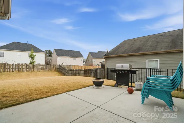 a view of a porch with furniture and a yard