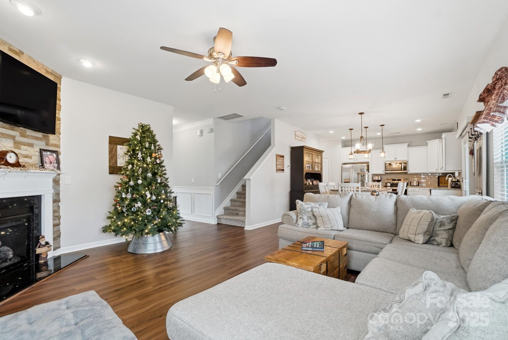 5033 Haven Lodge Road Matthews, NC 28104 - Photo 9 of 37 a living room with furniture and a flat screen tv