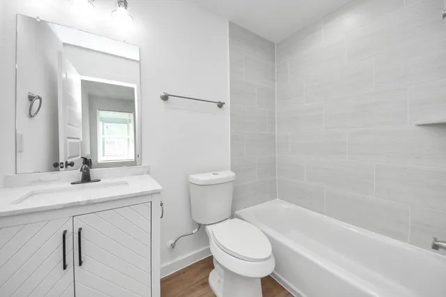 a bathroom with a sink a toilet and a bathtub