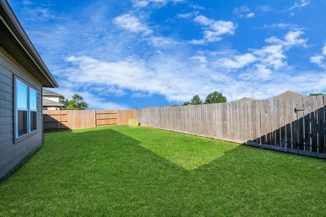 a view of a backyard with a cabin