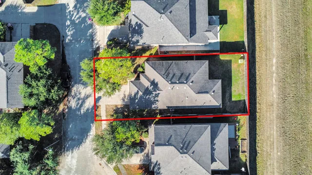 a backyard of a house with lots of green space