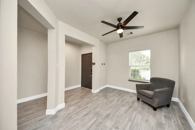 a living room with furniture and a window