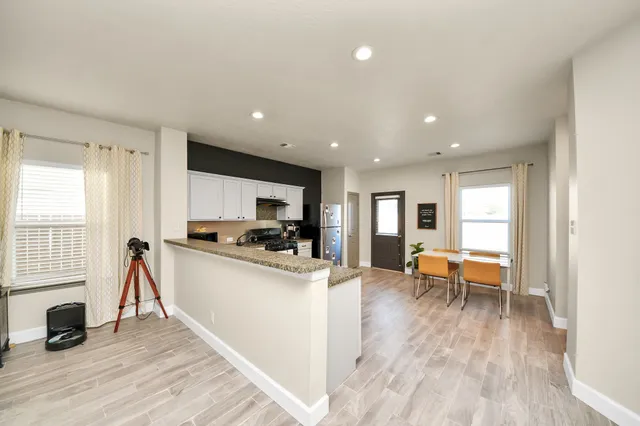 a view of a livingroom with furniture and a table