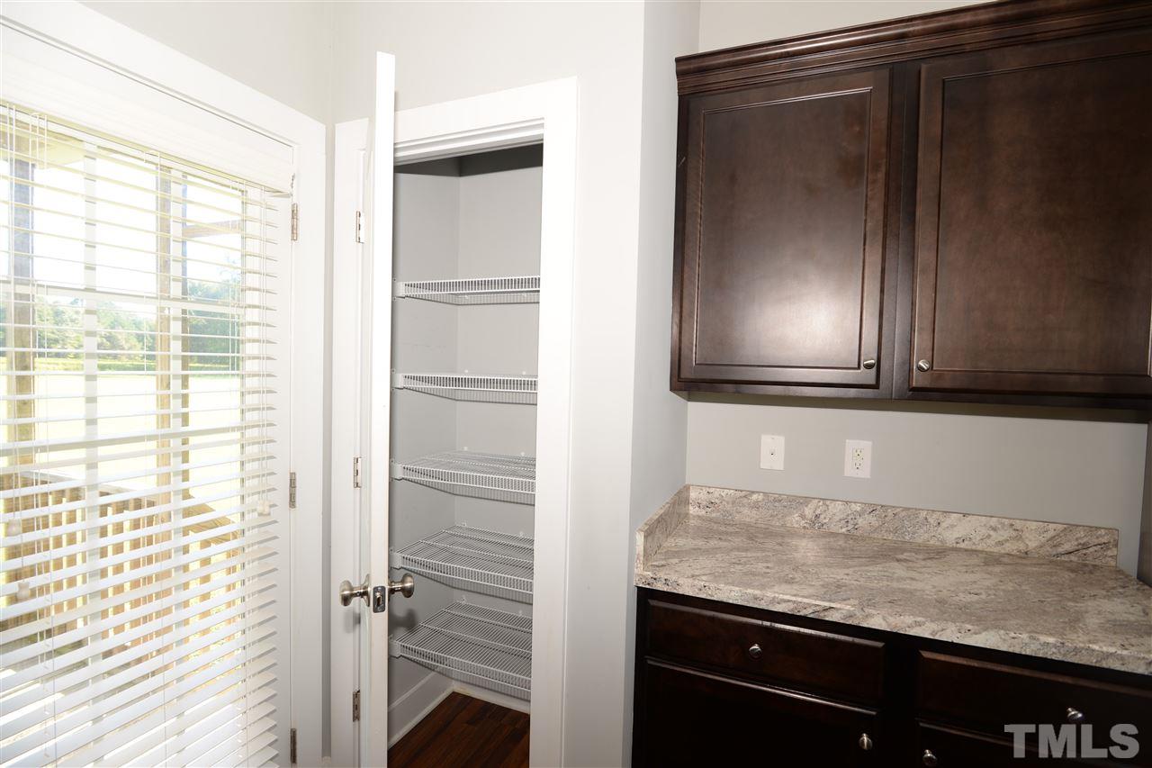 179 Red Wood Road Zebulon, NC 27597 - Photo 11 of 25 a bathroom with a granite countertop sink and a mirror