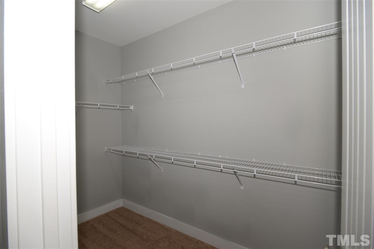 179 Red Wood Road Zebulon, NC 27597 - Photo 15 of 25 a view of a room with racks on the wall
