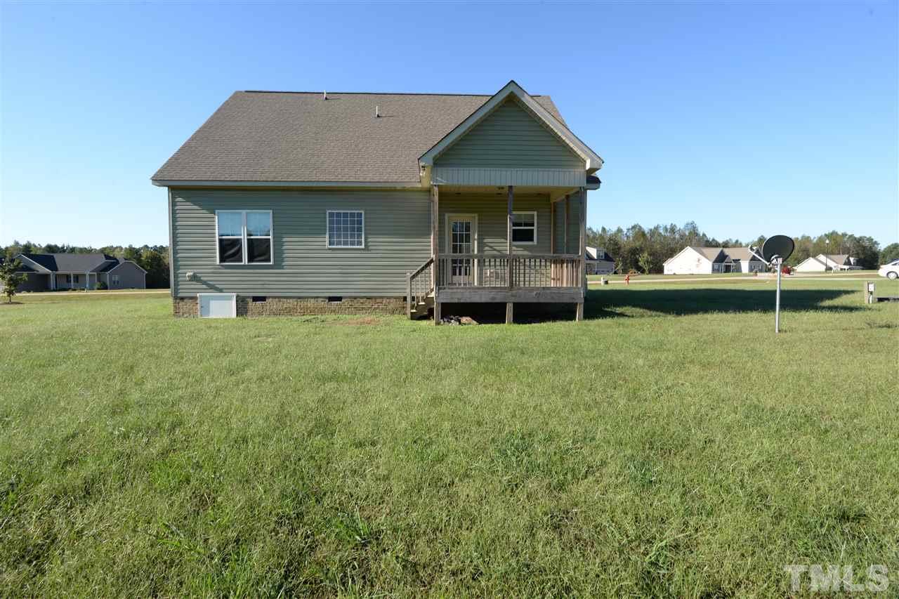 179 Red Wood Road Zebulon, NC 27597 - Photo 3 of 25 a front view of a house with garden