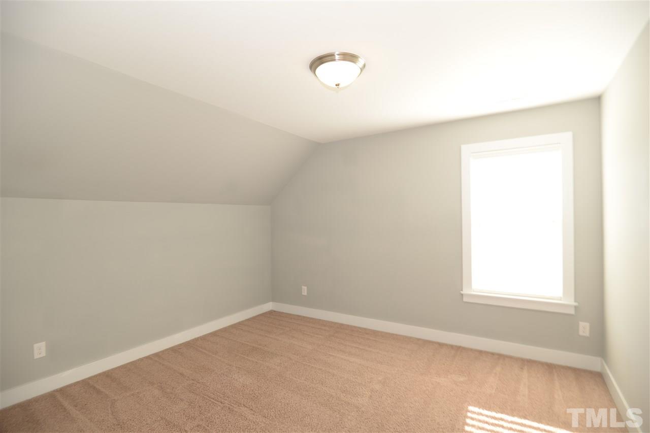 179 Red Wood Road Zebulon, NC 27597 - Photo 21 of 25 an empty room with a window