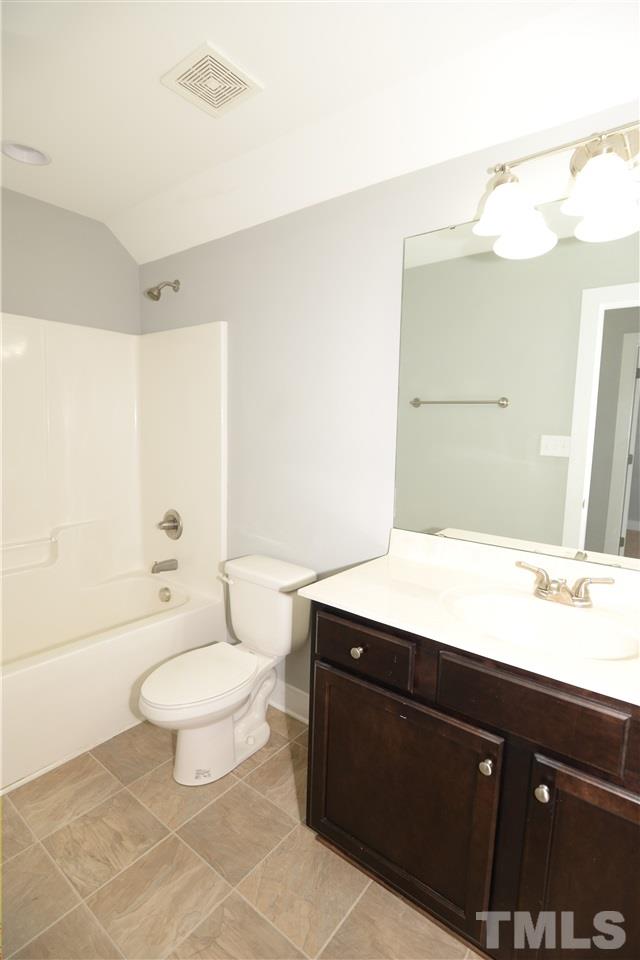179 Red Wood Road Zebulon, NC 27597 - Photo 22 of 25 a bathroom with a sink a toilet and shower