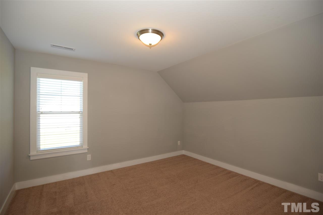 179 Red Wood Road Zebulon, NC 27597 - Photo 23 of 25 an empty room with a window