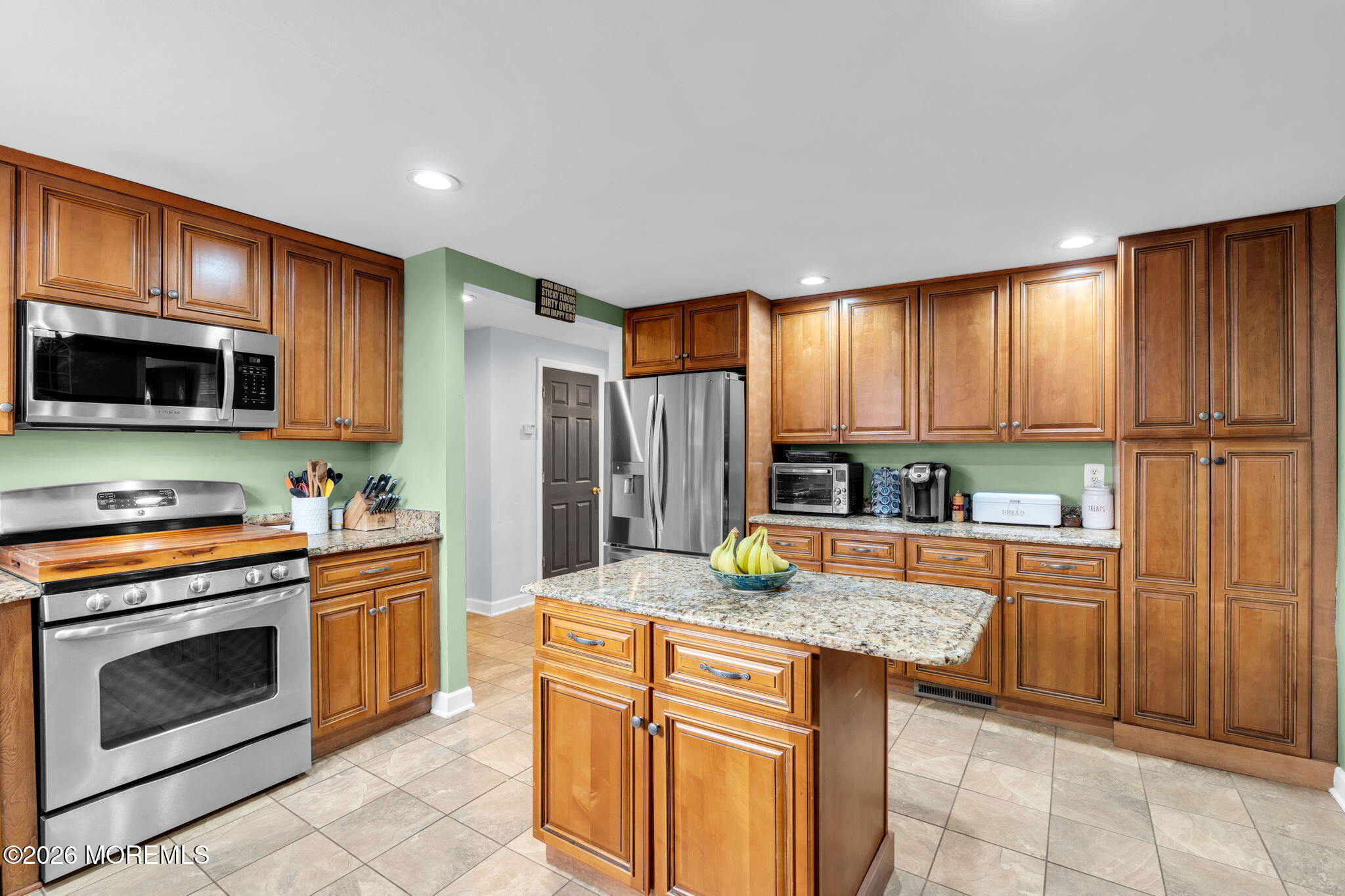824 5th Street Union Beach, NJ 07735 - Photo 15 of 32 a kitchen with granite countertop a stove sink and refrigerator