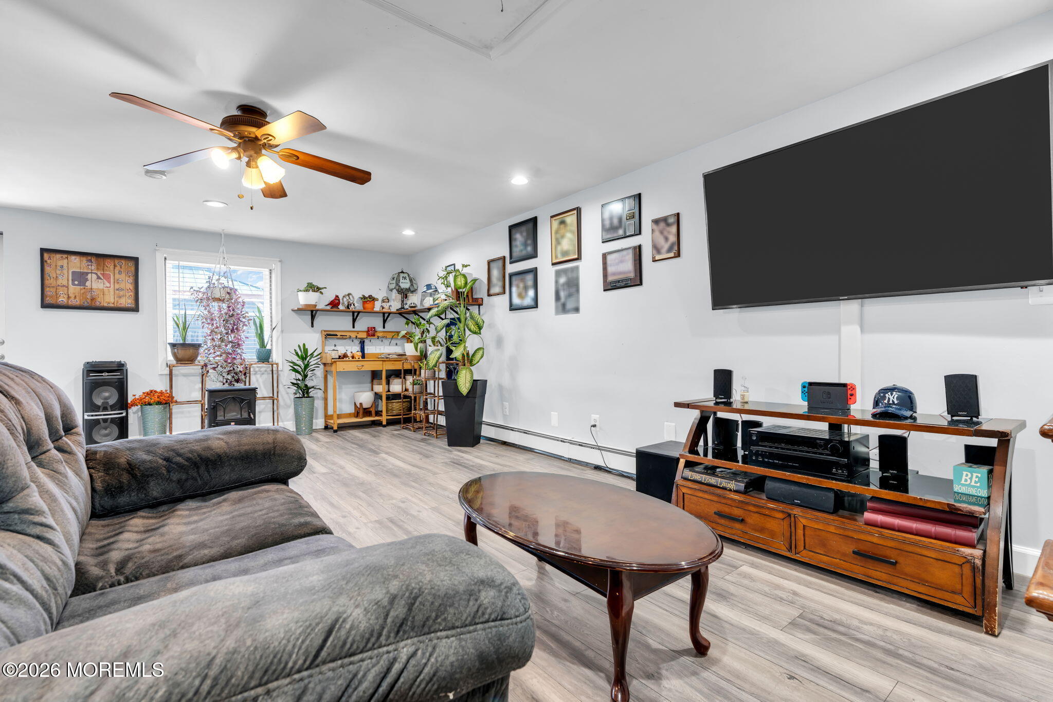 824 5th Street Union Beach, NJ 07735 - Photo 17 of 32 a living room with furniture and a flat screen tv