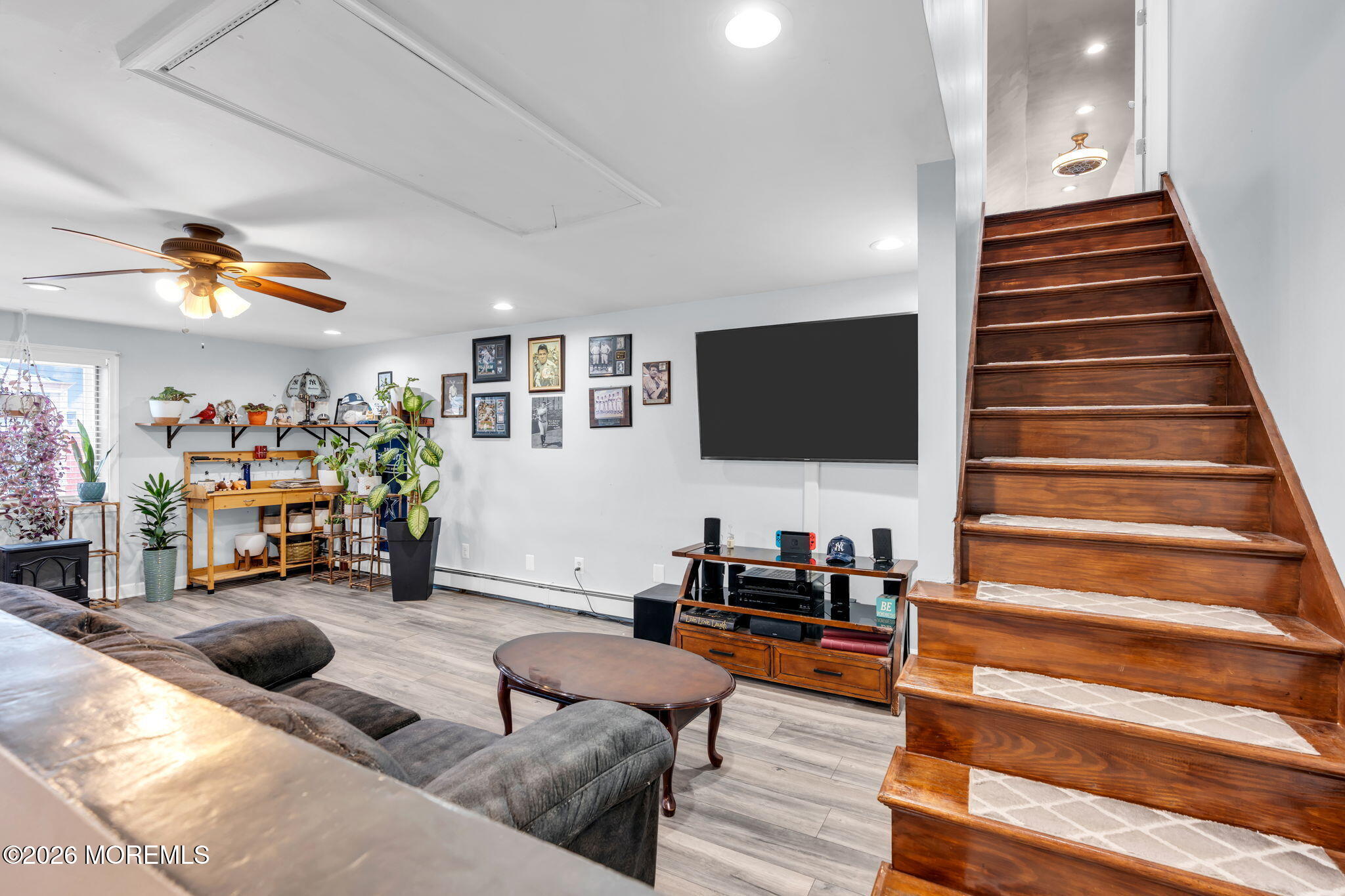 824 5th Street Union Beach, NJ 07735 - Photo 18 of 32 a living room with furniture and a flat screen tv