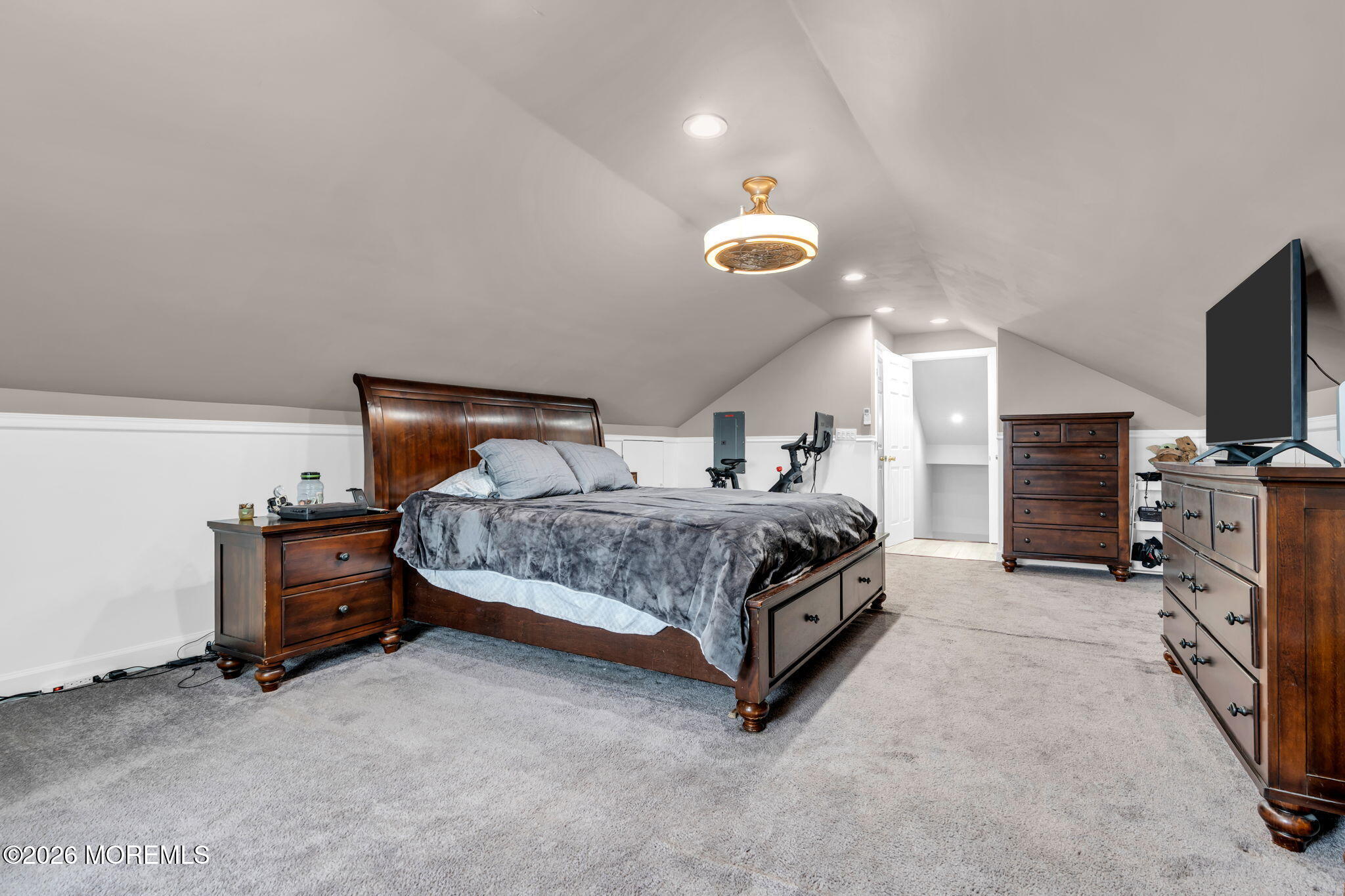 824 5th Street Union Beach, NJ 07735 - Photo 20 of 32 a bedroom with a bed and a flat tv screen on dresser