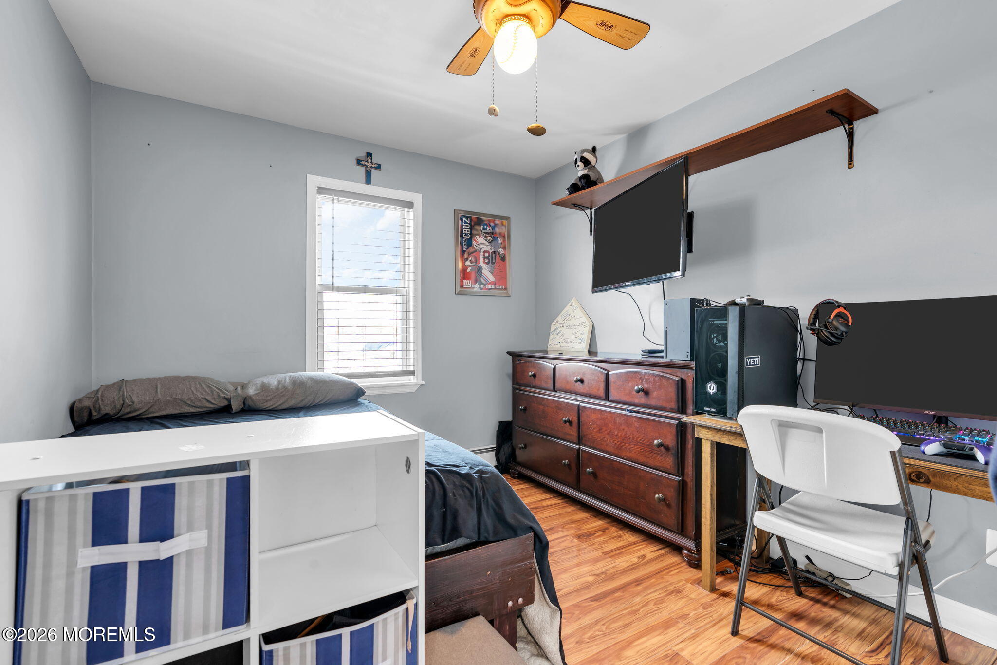 824 5th Street Union Beach, NJ 07735 - Photo 22 of 32 a bed room with a bed and a television