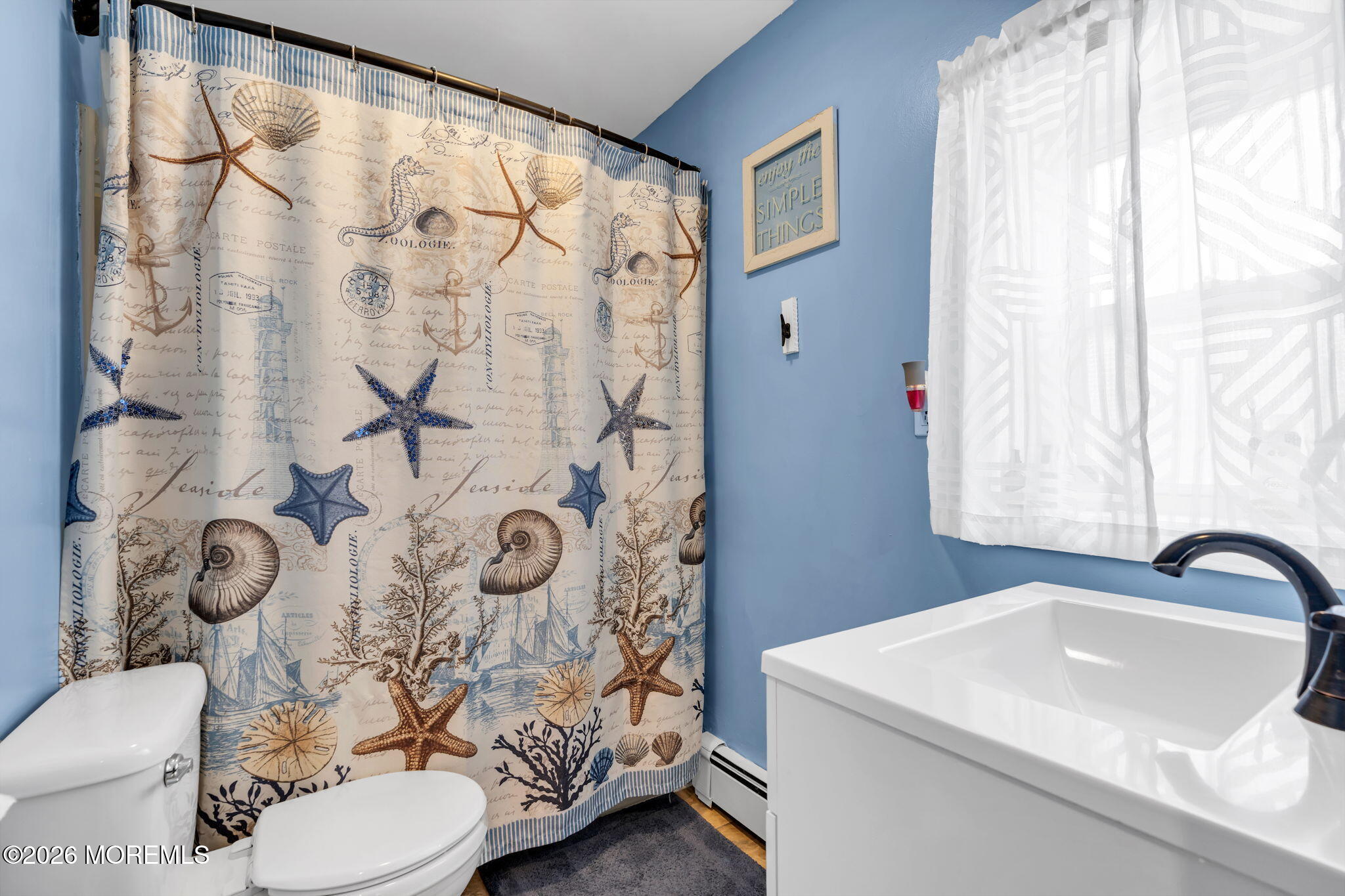 824 5th Street Union Beach, NJ 07735 - Photo 24 of 32 a bathroom with a sink toilet and shower