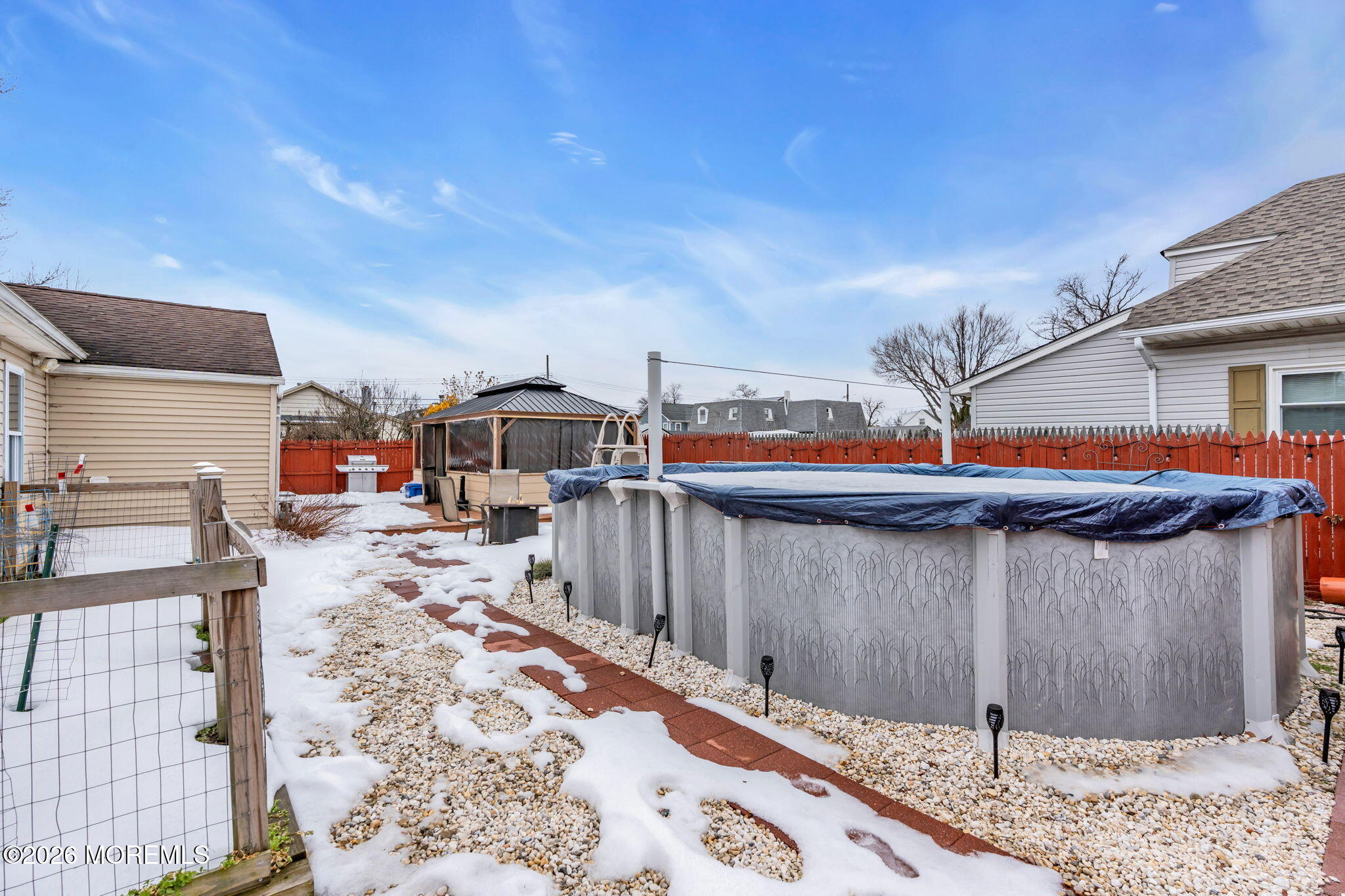 824 5th Street Union Beach, NJ 07735 - Photo 29 of 32 a view of a backyard with wooden fence
