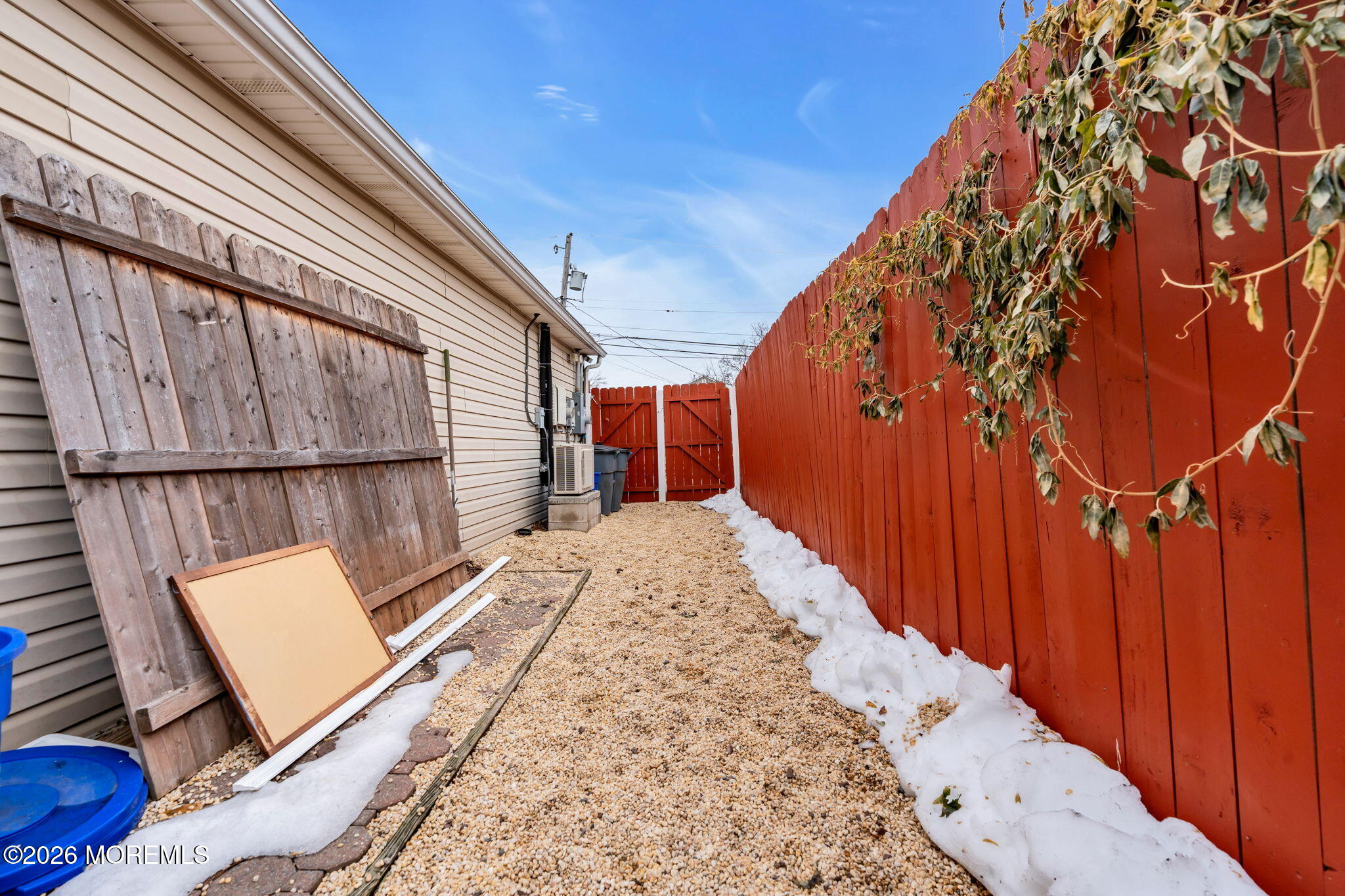 824 5th Street Union Beach, NJ 07735 - Photo 31 of 32 a view of a backyard with wooden fence