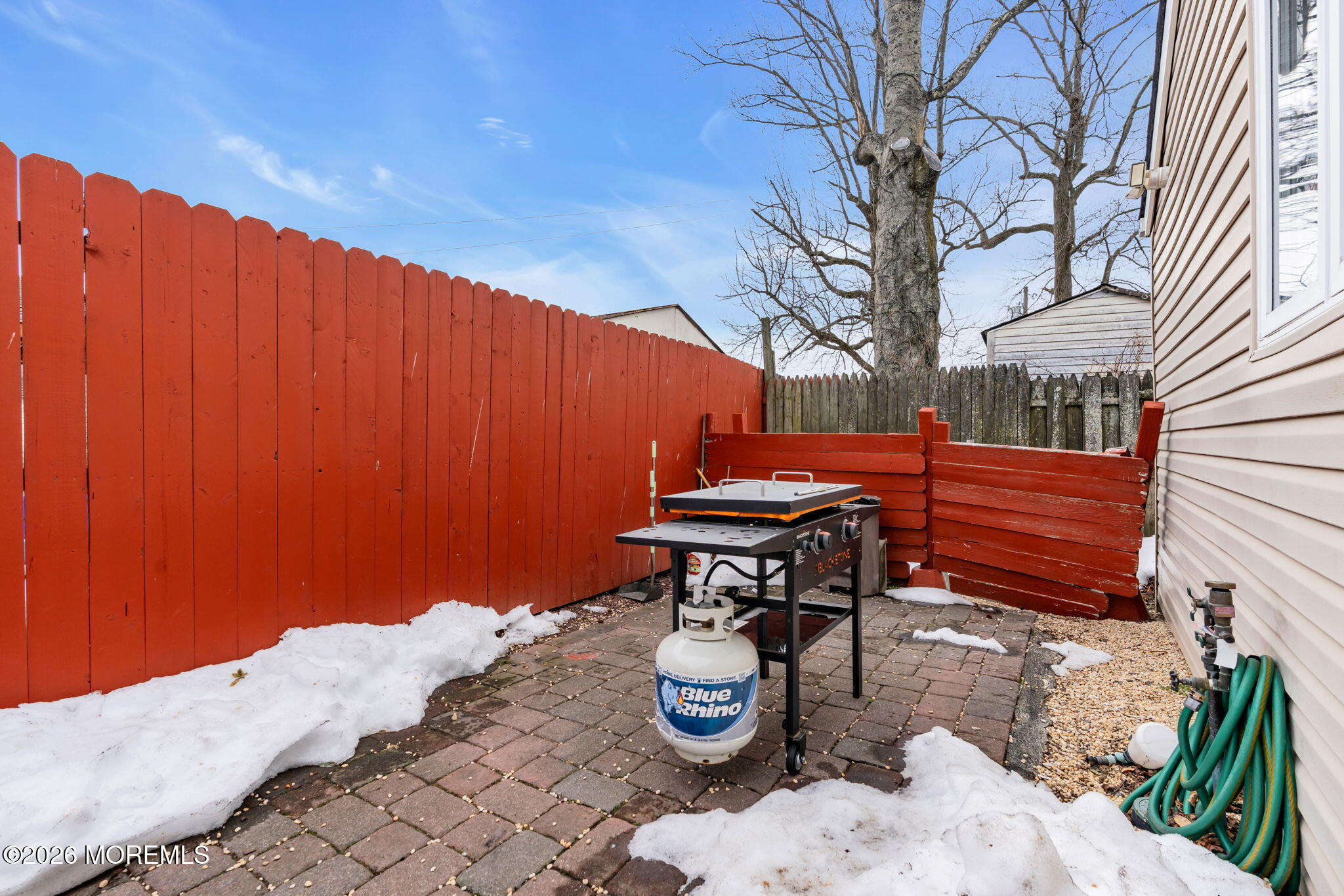 824 5th Street Union Beach, NJ 07735 - Photo 32 of 32 a backyard view with sitting space and trees