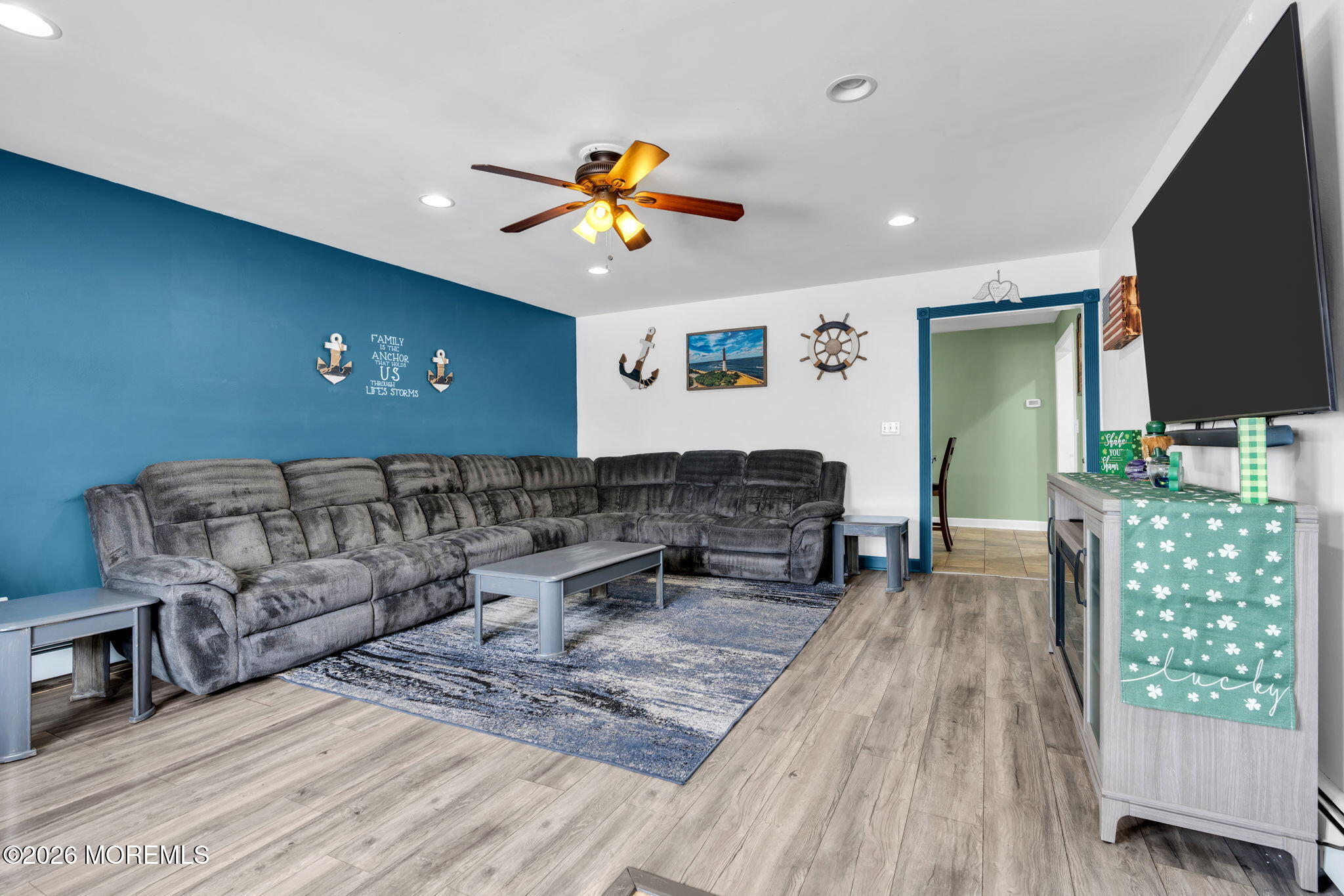 824 5th Street Union Beach, NJ 07735 - Photo 6 of 32 a living room with furniture and a flat screen tv