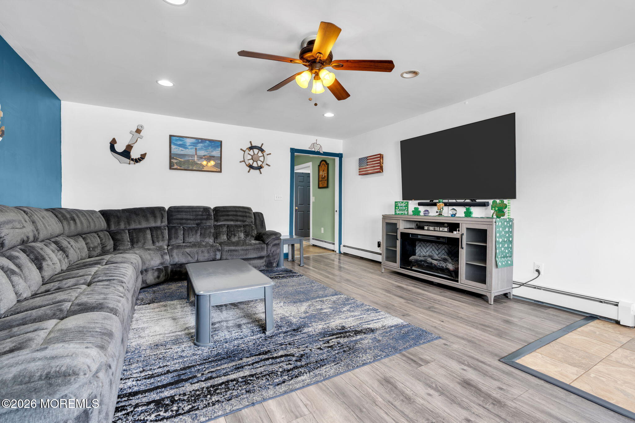 824 5th Street Union Beach, NJ 07735 - Photo 7 of 32 a living room with furniture and a flat screen tv