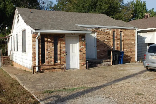 a view of a house with entrance gate