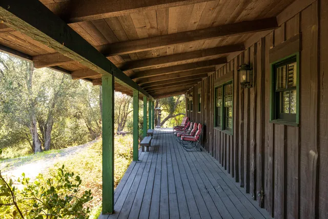 a view of a porch with wooden floor