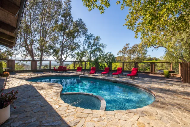 a view of a swimming pool with a patio