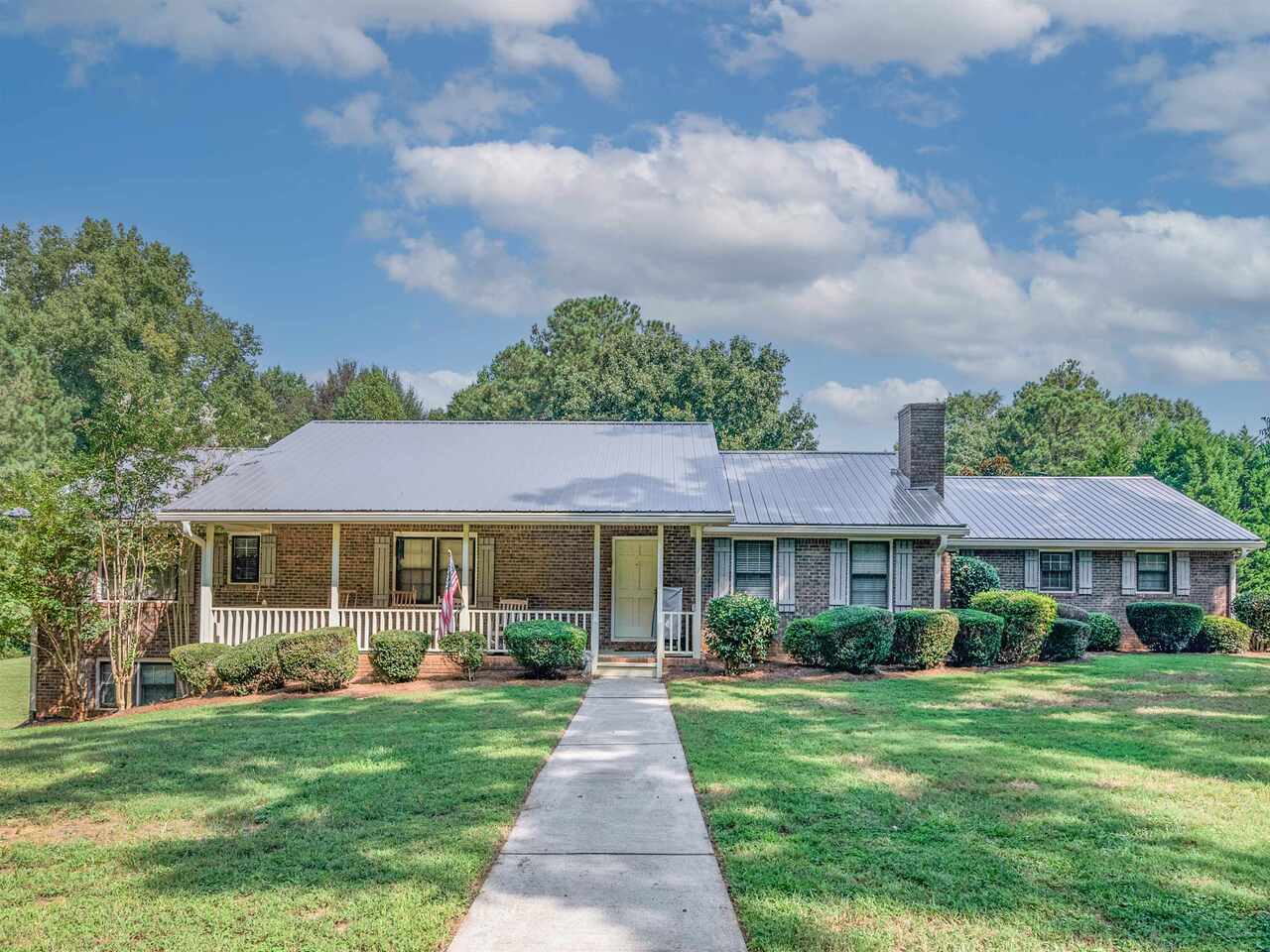 102 Presley Road Jackson, GA 30233 - Photo 1 of 1 a front view of a house with a yard