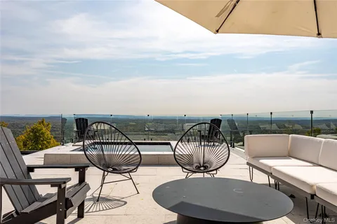 a view of a chairs and table in the terrace