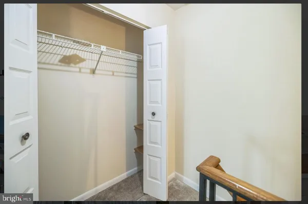 a view of front door with wooden floor