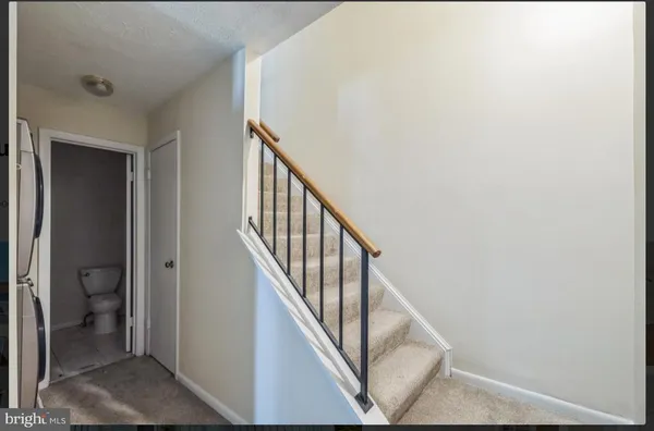 a view of a hallway with staircase