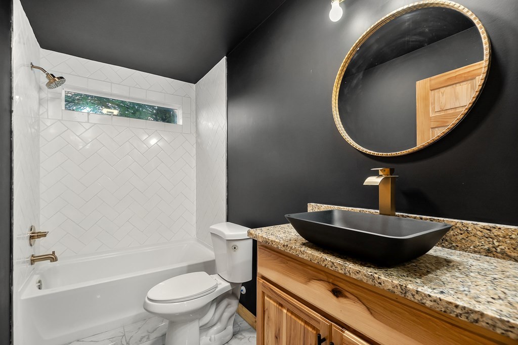 120 Joshua Road Cookeville, TN 38501 - Photo 17 of 21 a bathroom with a granite countertop toilet sink and mirror