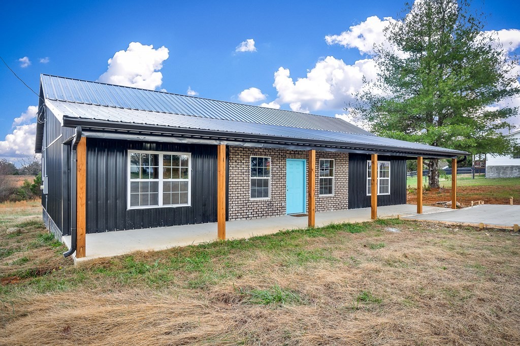 120 Joshua Road Cookeville, TN 38501 - Photo 2 of 21 a view of a house with a yard and porch