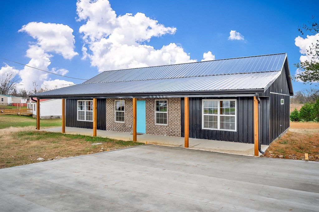 120 Joshua Road Cookeville, TN 38501 - Photo 3 of 21 a view of a house with a garden and yard
