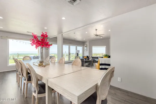 a view of a dining room with furniture and wooden floor
