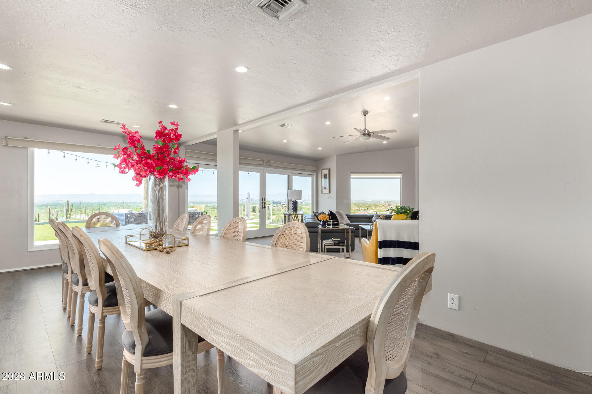 6526 North 37th Street Phoenix, AZ 85018 - Photo 12 of 51 a view of a dining room with furniture and wooden floor