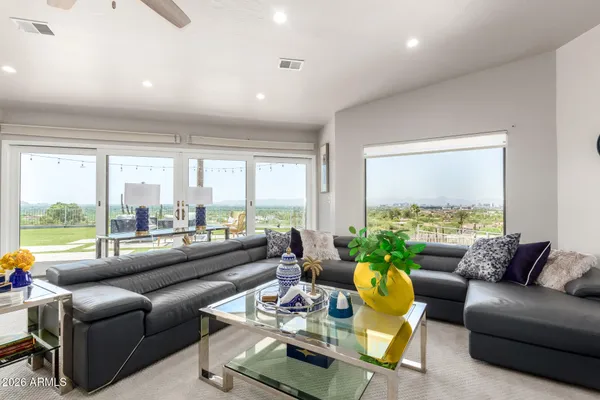 a living room with furniture and a large window