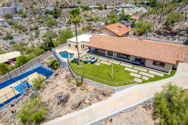 an aerial view of a house with a swimming pool