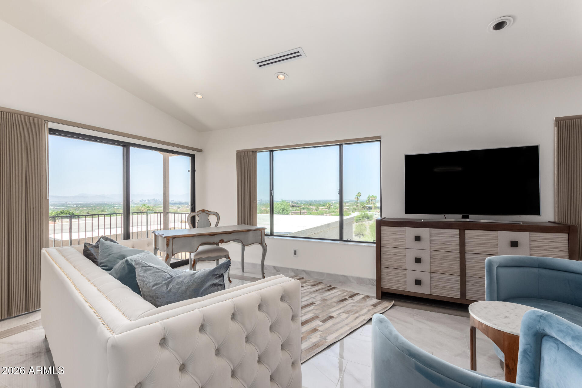 6526 North 37th Street Phoenix, AZ 85018 - Photo 21 of 51 a living room with furniture and a flat screen tv