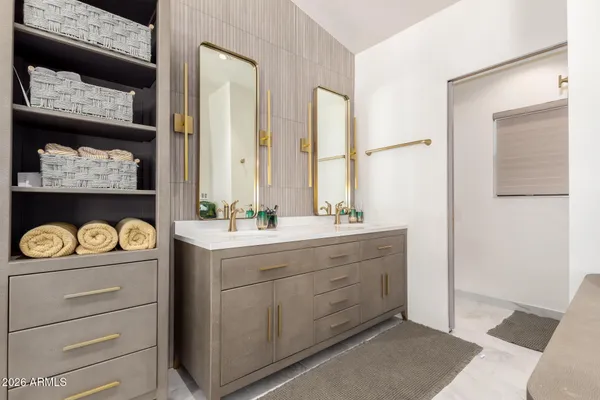 a bathroom with a sink and a mirror