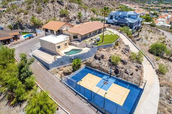 an aerial view of a house with a ocean view