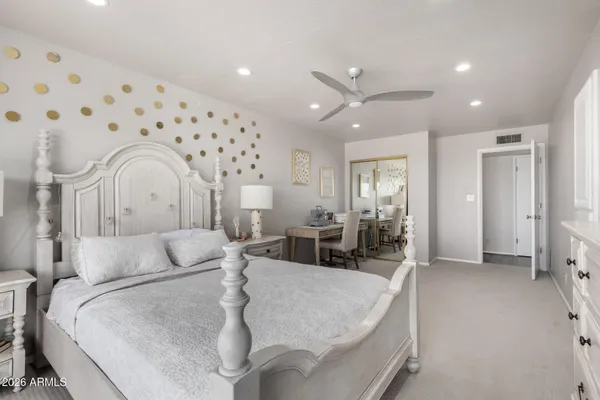 a room with a bed and a desk