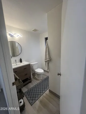 a bathroom with a double vanity sink and mirror