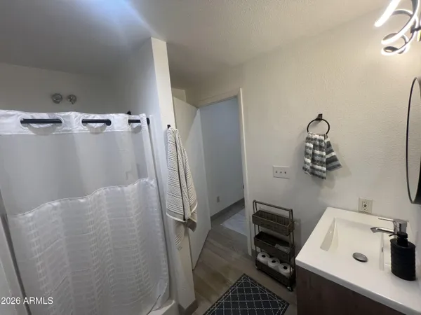 a bathroom with a toilet sink and a mirror
