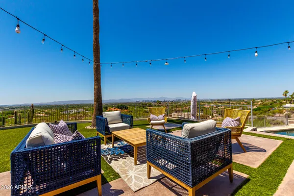 a view of a terrace with chairs