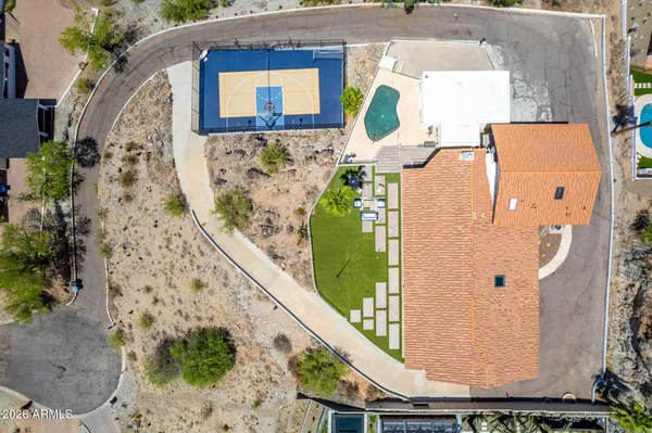 an aerial view of a house with a swimming pool