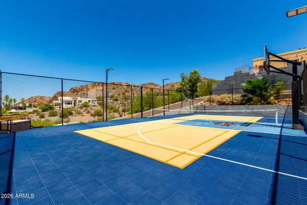 a view of a swimming pool with an outdoor seating